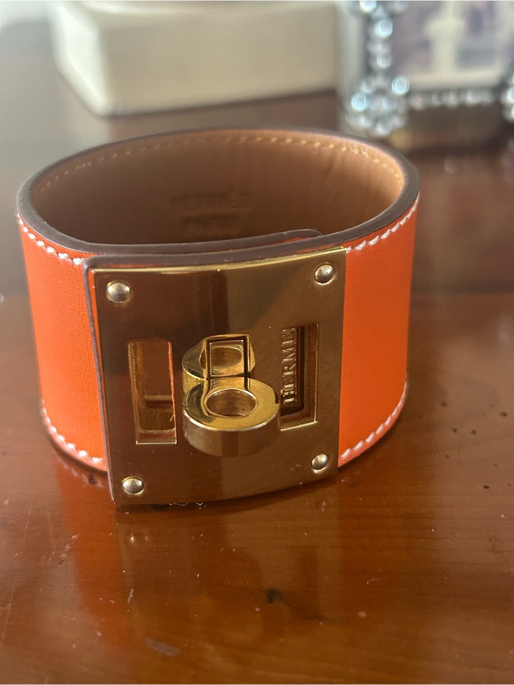 Hermès Orange Leather Cuff Bracelet with Gold Turnlock